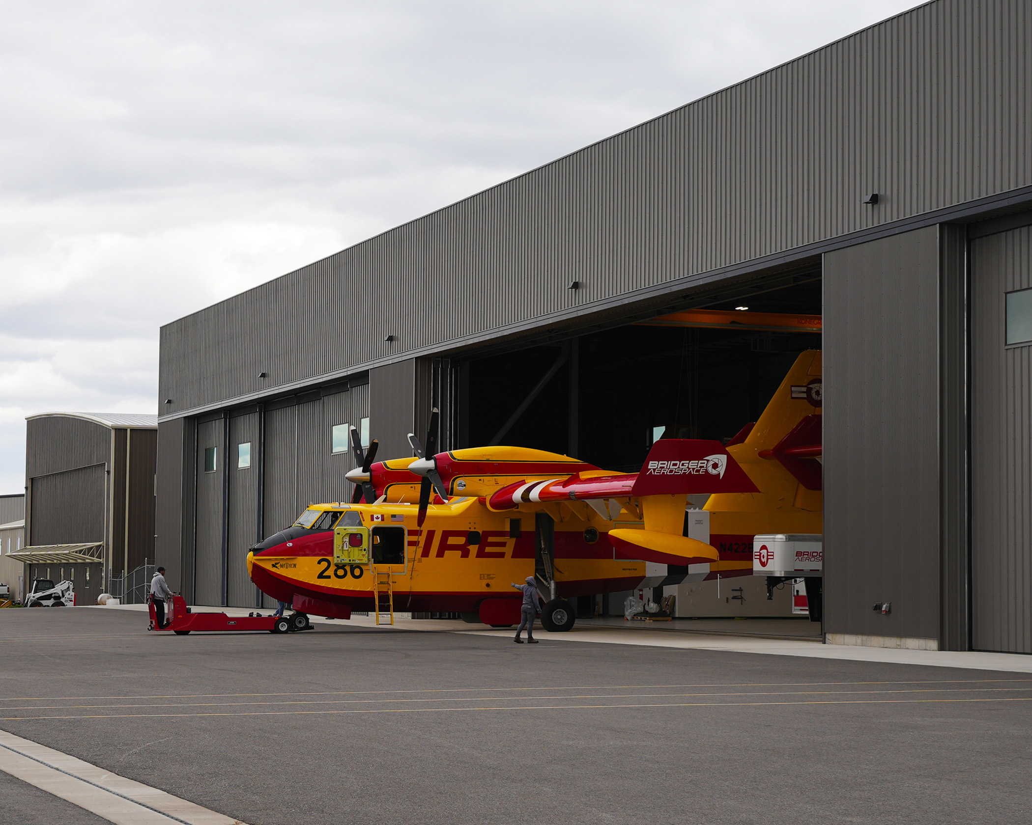 fire plane coming out of a hanger at Bozeman-Yellowstone International Airport